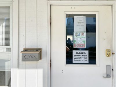 Box of CLYNK bags next to the door of the TurnStyle