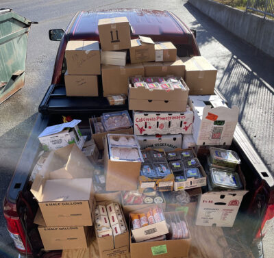 Truck bed full of food for the pantry from Hannaford